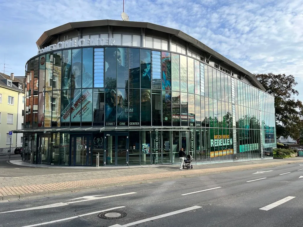 Building with a rounded glass facade on a street corner